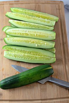 the cucumber is cut up and ready to be sliced into smaller wedges