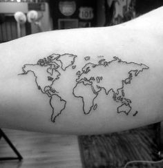 a black and white world map tattoo on the arm