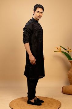 Black cotton kurta with pintuck detailed satin yoke. Paired with a matching churidar in cotton fabric. - Aza Fashions Black Cotton Silk Kurta For Festive Occasions, Festive Black Cotton Silk Kurta, Black Chanderi Sherwani For Navratri, Black Cotton Silk Kurta For Eid, Black Cotton Silk Fitted Kurta, Black Fitted Cotton Silk Kurta, Black Cotton Silk Kurta For Festivals, Men Kurta, Cotton Kurta