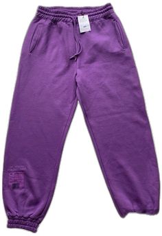 Purple Sweatpants For Spring Streetwear, Relaxed Fit Purple Pants For Streetwear, Purple Sweatpants With Pockets For Streetwear, Purple Cotton Athleisure Pants, Purple Relaxed Fit Sweatpants For Athleisure, Purple Bottoms With Elastic Waistband For Streetwear, Purple Cotton Sweatpants For Streetwear, Purple Stretch Pants For Streetwear, Stretch Purple Pants For Streetwear