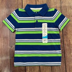 Green, Blue, And White Striped Short Sleeve Polo Shirt. Size 12 Months. Nwt Cute Blue Collared Top, Playful Fitted Blue T-shirt, Blue Short Sleeve Tops For Playtime, Cute Blue Collared Shirt, Blue Short Sleeve Shirt For Playtime, Playful Blue Collared Top, Playful Collared Blue Tops, Cute Fitted Blue Shirt, Blue Shirt For Playtime In Spring