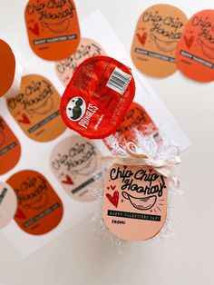 a package of chips sitting on top of a piece of paper next to some stickers