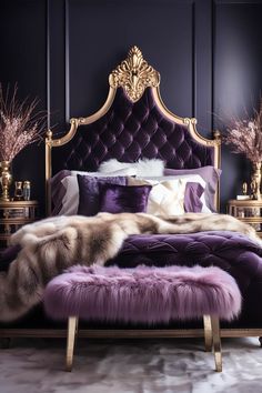 a bed with purple and gold decor in a dark colored room, it has a fur rug on the foot board