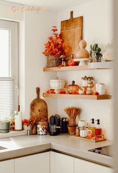 the kitchen counter is clean and ready for us to use as an autumn shelf decoration