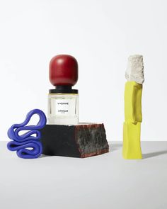 an assortment of objects are displayed on a white surface with one object in the foreground