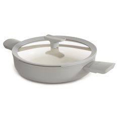 a white pan with an open lid on a white background, showing the handle and handles