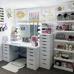 a white desk topped with lots of drawers next to shelves filled with makeup and other items