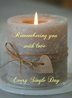 a candle that is on top of a glass plate with a ribbon around it and the words, remembrance you with love every single day