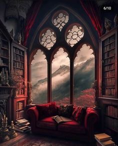 a red couch sitting in front of a large window filled with books next to a book shelf