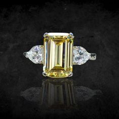 "Personally Designed Art Deco ring in sterling silver. Main gemstone size: 12*8mm Main Stone: Citrine Side Stone: Clear Topaz It's made of fine (solid) sterling silver that is polished and dipped in Rhodium. It has a bright finish and it doesn't tarnish. This classically designed ring is made with beautifully citrine with Emerald cut. Solid and thick band with a professional finish. You will not be disappointed with this beautiful ring. 💎 Gem Stone: Lab treated Yellow citrine with emerald cut. Emerald Cut Yellow Topaz Ring For Wedding, Yellow Topaz Emerald-cut Ring In Fine Jewelry, Yellow Emerald Cut Topaz Ring In Fine Jewelry Style, Yellow Emerald-cut Topaz Ring Fine Jewelry, Fine Jewelry Yellow Gemstones For Wedding, Yellow Gemstones For Wedding Fine Jewelry, Yellow Gemstones For Wedding, Fine Jewelry, Fine Yellow Gemstones For Wedding, Yellow Topaz Ring With Center Stone In Sterling Silver