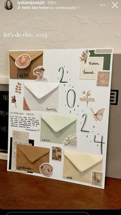 an image of a greeting card with envelopes and numbers on the front, along with other cards