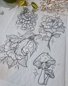 a drawing of flowers and mushrooms on a napkin