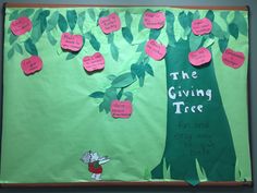 the giving tree is made up of green paper and pink sticky notes