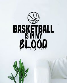 a basketball is in my blood wall decal on a white wall next to a potted plant