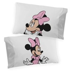 two mickey and minnie mouse pillow cases with pink bows on the ears, one is facing forward