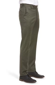 Stretch-infused wool gabardine defines handsome trousers crafted in a crisp, versatile flat-front cut. 16 1/2" leg opening; 9 1/4" front rise; 14 3/4" back rise Zip fly with button-tab closure Slant pockets; back button-closure welt pockets Unhemmed. These trousers can be hemmed for free at your local Nordstrom. Find a store Lined to the knee 98% wool, 2% spandex Dry clean Imported Men's Clothing Wool Trousers, Wool Dress, Modern Fit, Welt Pocket, Welt Pockets, Parachute Pants, The Knee, Dress Pants, Men's Clothing