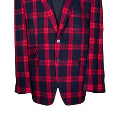 This Chiragh Apparel blazer is an elegant upgrade on dapper tailoring and features rich shades in a sumptuous fabric for elegant opulence. Fashioned from premium quality wool, this plaid check blazer features full lining in Japanese silk, a notch lapel, two-button closure and single-vented back. A left chest pocket and three flap pockets appoint the front while the inside has two (2) pockets on the left and one (1) pocket on the right. A flash of contrast piping is added to the jacket lining ins Formal Red Outerwear With Hidden Button Closure, Red Formal Outerwear With Hidden Button Closure, Red Semi-formal Blazer With Buttons, Red Formal Suits With Button Closure, Red Single Button Formal Blazer, Red Fitted Blazer With Hidden Button Closure, Elegant Red Blazer With Button Closure, Red Formal Outerwear With Welt Pockets, Red Notch Lapel Blazer With Hidden Button Closure