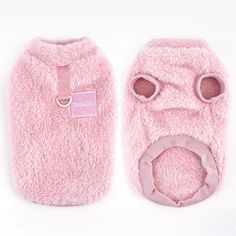 a pair of pink slippers with eyes and nose are shown on a white background