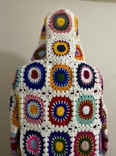 a crocheted granny bag with multicolored circles on it