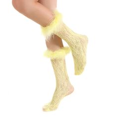 Be bold and stand out with these Destiny Feather Trim Lace Crew Socks! These raiment-ready beauties have the perfect amount of y2k vibes, and can pull up to mid calf or slouch, so you can 'flex' your style in any way you please. Semi-sheer nylon socks patterned in all-over crochet style lace. Hand-sewed feather trim just screams glam. Complete with a stretchy spandex cuff. So whether you're feeling more 'short and sweet' or edgy and elongated, these pastel yellow aesthetic socks will take you st Trendy Knee-high Party Socks, Trendy Spring Knee-high Socks For Party, Trendy Spring Party Knee-high Socks, Trendy Party Socks For Spring, Trendy Yellow Socks, Trendy Yellow Winter Socks, Fitted Yellow Socks For Spring, Trendy Soft Socks For Spring, Trendy Spring Socks