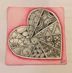 a drawing of a heart with swirls and circles on it's side in pink paper