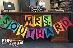 the front desk is decorated with colorful letters