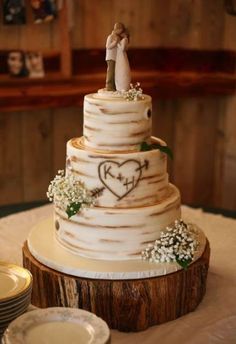 a wedding cake with a bride and groom on top