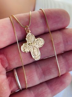 This is a beautiful four way cross charm necklace in gold or silver.  This lovely detailed pendant measures 22x18mm and comes on a shiny cable chain with spring clasp.  The four way cross in made of 925 sterling silver.  The gold version is 16k gold over 925 sterling silver.  The gold charm necklace comes on a 14k gold filled box chain.  The silver charm necklace is all 925 sterling silver.  This charm is made by master silversmiths in New England that have perfected their craft with such imagery and detail, you will be impressed with their work!  Model is wearing a 16 inch length. also available an 18 inch or 20 inch length. Please choose your desired length.  Comes in a cute gift box ready to present! THE FOUR WAY CROSS MEANING... The Sacred Heart - At the top of the cruciform is the sac Cross Necklace With Charms As Gift, Gold Cross Pendant Necklace With Box Chain, Yellow Gold Cross Jewelry With Box Chain, Crucifix Box Chain Necklace For Gift, Gold Cross Necklace With Box Chain, Spiritual Cross Jewelry With Box Chain, Spiritual Cross Box Chain Jewelry, Crucifix Charm Necklace As Gift, Crucifix Charm Necklace For Gift