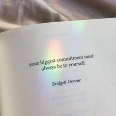 an open book with the words, your biggest comminment must always be to yourself