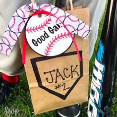 a paper bag with a baseball and bat on it that says good day jack 2