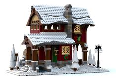 a lego house is shown with snow on the roof