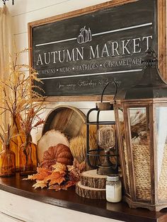 an autumn market sign sitting on top of a mantle