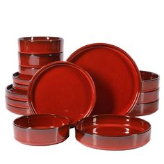 red dinnerware is stacked on top of each other