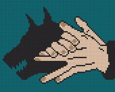 a cross stitch pattern with a hand holding a dog