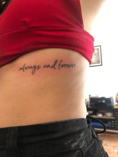 a woman's stomach with the words always and forever tattooed on her lower back