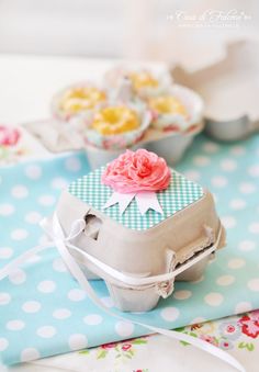 there are several pictures of small cakes and cupcakes on the table with ribbons