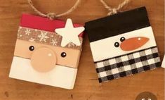 two paper bags decorated like snowmen on a wooden table