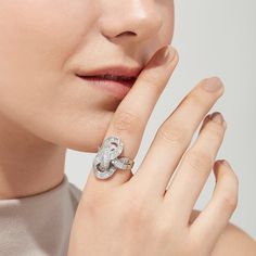 a close up of a person wearing a ring