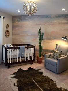 a baby's room with a crib, chair and cactus in the corner