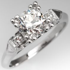 a diamond ring with three stones on it