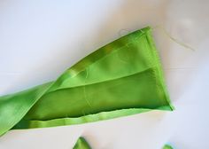 a green piece of cloth is laying on the table