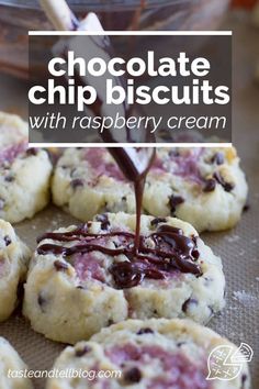 chocolate chip biscuits with raspberry cream being drizzled