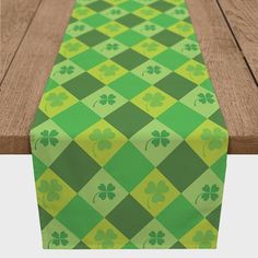 a green and yellow table runner with shamrocks on it