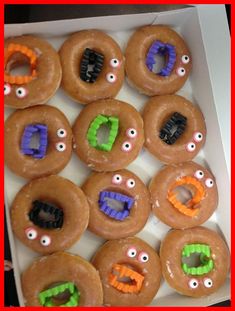 a box filled with donuts decorated like monsters