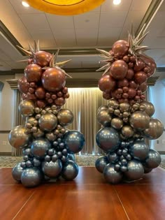 two large balloons sitting on top of a wooden table