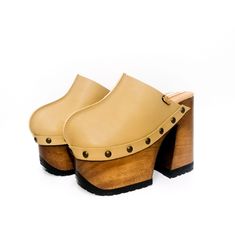 Handmade leather platform clogs. Wooden sole with 8 cm platform and 14 cm heel, black tractor rubber, the wood is protected by lacquer and has padded insole lined in goat suede to give more comfort to the foot. They are made in genuine sand color leather, lined in natural leather, on the sides they have old gold studs. Vintage clogs are an exclusive design by Sol Caleyo. Sizes from 33 to 47, if this is not your size do not hesitate to contact us. They are made one by one for each customer and it Heel Platforms, Clogs Platform, Wood Clogs, Vintage Clogs, Platform Clogs Shoes, High Heel Sandals Platform, Wood Heels, Platform Shoe, Handmade Leather Shoes