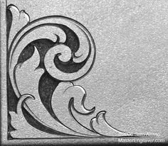 an art nouveau design on the side of a metal sheet with black and white paint