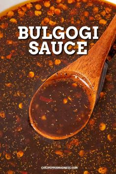 a wooden spoon is in a bowl filled with chili and cheese sauce that reads, bulgogi sauce