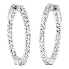 Introducing our exquisite Natural Diamond Hoops in 18KT White Gold—a true embodiment of elegance and luxury. These Single Row Diamond Hoop Earrings are meticulously crafted to elevate your style and make a lasting impression. Designed with utmost attention to detail, these elegant diamond hoops feature a single row of stunning natural diamonds. Each diamond is expertly set in a sleek and sophisticated 18KT white gold hoop, creating a captivating and timeless design. The brilliance of the diamonds combined with the lustrous white gold setting exudes a luxurious aura that will turn heads wherever you go. Indulge yourself or surprise a loved one with these magnificent Natural Diamond Hoops. They make a truly unforgettable gift for any occasion, symbolizing love, celebration, and enduring eleg Luxury Minimalist Hoop Earrings With Single Cut Diamonds, Luxury Small Hoop Earrings In White Gold, Luxury White Gold Channel Set Hoop Earrings, Luxury Timeless Diamond White Hoop Earrings, Modern Diamond Earrings, White Gold Hoops, White Gold Set, Diamond Hoop Earrings, Jewelry Earrings Hoops