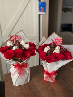 two valentine's day bouquets on a table